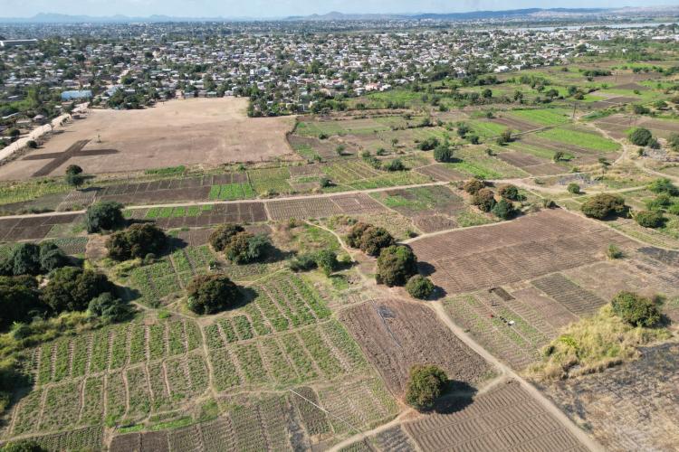 Aerial view of farmland and settlements near a river in Lilongwe, Malawi